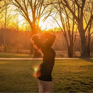 Black backless long sleeve with feathers